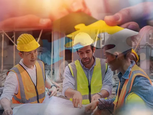 Three people talking on construction site