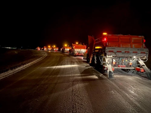 Nighttime snowplows on I-380