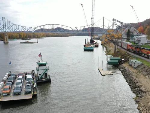 Mississippi River Bridge with car ferry in foreground