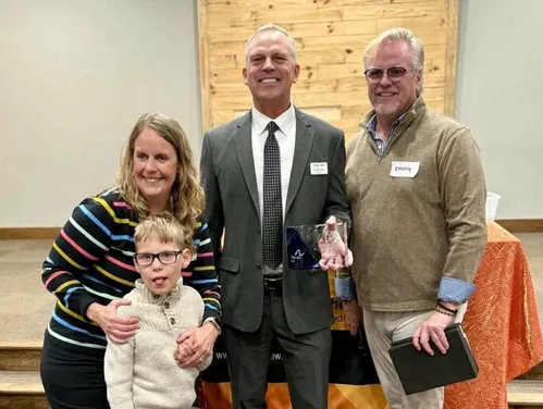 Design Bureau Director Kent Nicholson accepts award from Arc of Iowa