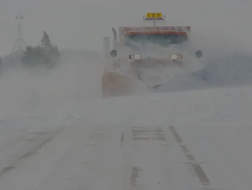 DOT snowplow clearing in whiteout conditions