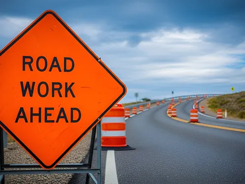 Photo of Road Work Ahead sign on construction site