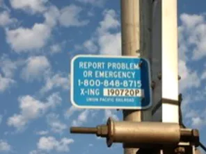 report rough crossing sign at crossing