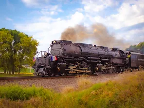 Union Pacific Big Boy 4014 steam train on rural railroad tracks