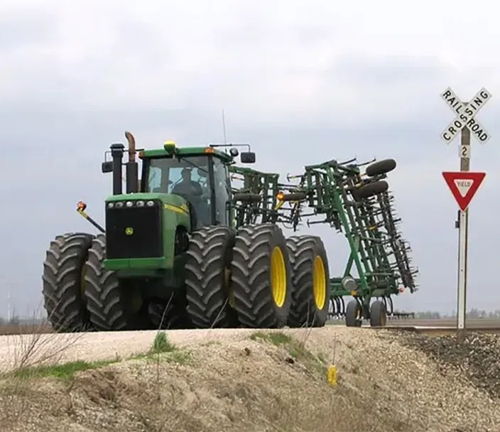 Tractor crossing railroad tracks