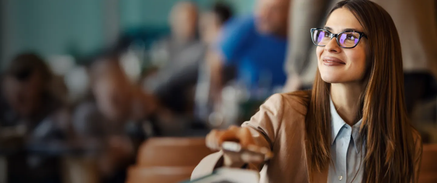 Woman in restaurant scanning Mobile ID