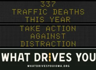 Traffic roadside graphic with text of the news article title.