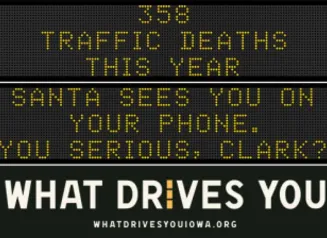 Traffic roadside graphic with text of the news article title.