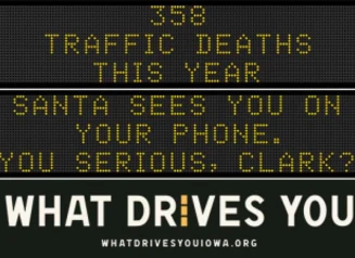 Traffic roadside graphic with text of the news article title.