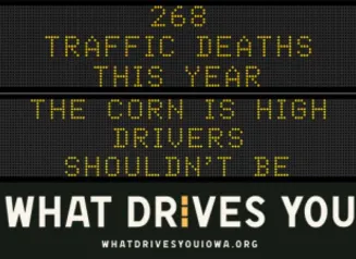 Traffic roadside graphic with text of the news article title.