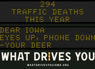 Traffic roadside graphic with text of the news article title.