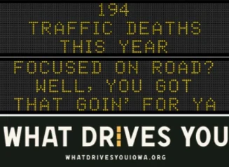Traffic roadside graphic with text of the news article title.