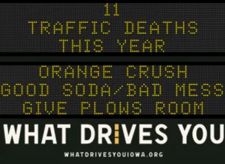 Traffic roadside graphic with text of the news article title.