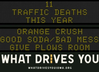 Traffic roadside graphic with text of the news article title.