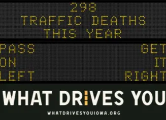 Traffic roadside graphic with text of the news article title.