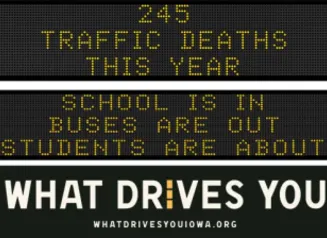 Traffic roadside graphic with text of the news article title.