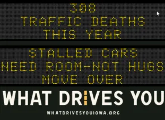 Traffic roadside graphic with text of the news article title.