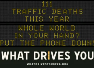 Traffic roadside graphic with text of the news article title.