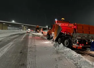 DOT snowplow on interstate with traffic