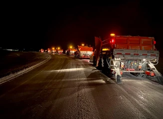 Nighttime snowplows on I-380