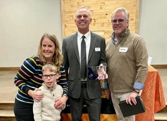 Design Bureau Director Kent Nicholson accepts award from Arc of Iowa
