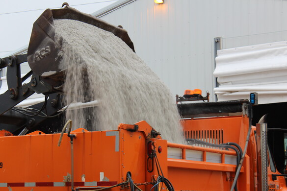 Road salt dumped into plow