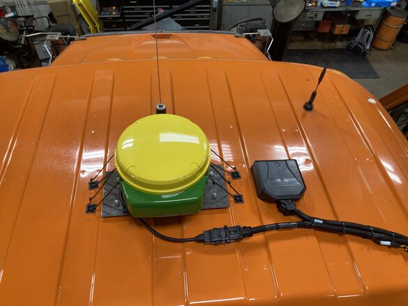 John Deere Path mounted on snowplow cab roof