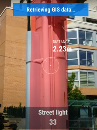 screenshot of an augmented reality view of a street light with data about the light shown