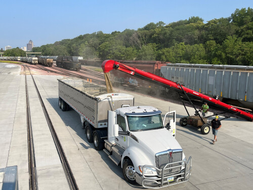 A transload facility with materials moved from a rail car to a truck