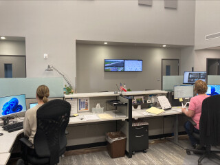two people at an office reception desk