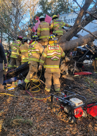 Many first responders working to help at the scene of a crash