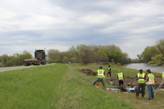 A road crew working alongside a highway