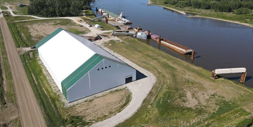 aerial view of a large building near a river