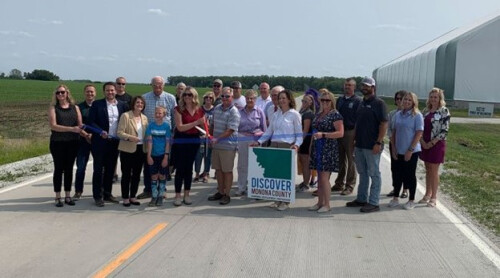 people standing at a ribbon cutting ceremony