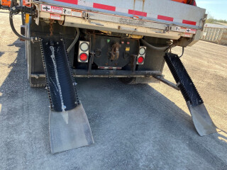 custom cut pipe on the back of a salt truck