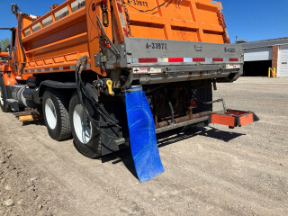a custom discharge hose on the back of a salt truck