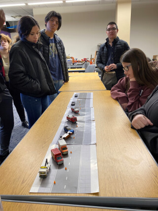 Students with a hands-on activity in a classroom