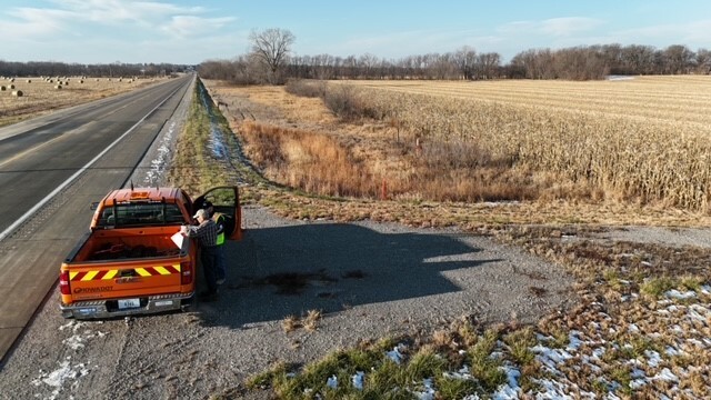 DOT truck and district staff with farmer
