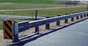 ET‑Plus guardrail end terminal installed along a roadside.