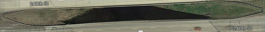 Bullnose guardrail forming a U shape in a median, with each end connecting to other barrier sections.