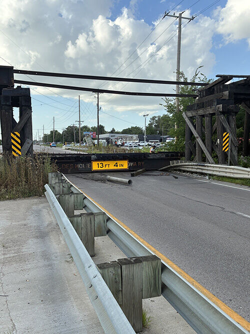 Looking north at Railroad bridge collapse on Iowa 415 NW 2nd Street after collapse.