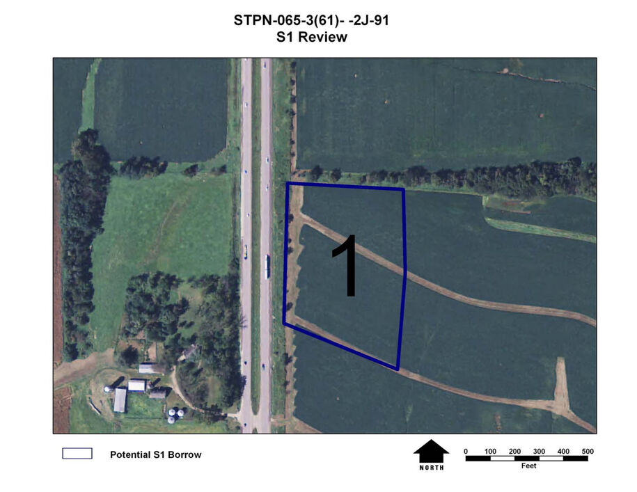 Zoomed‑in aerial map showing outlined Potential S1 Borrow Site 1 next to a roadway, with north arrow and scale bar.